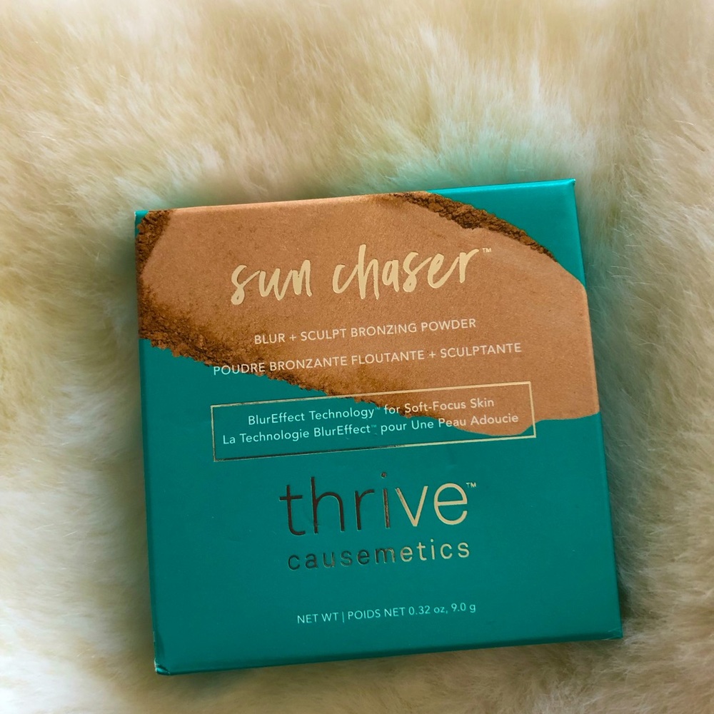 Thrive bronzing powder. New in original box.